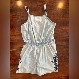Blue romper with embroidered detail